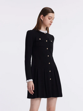 a lady in black ruffle collared single-breasted pleated mini dress